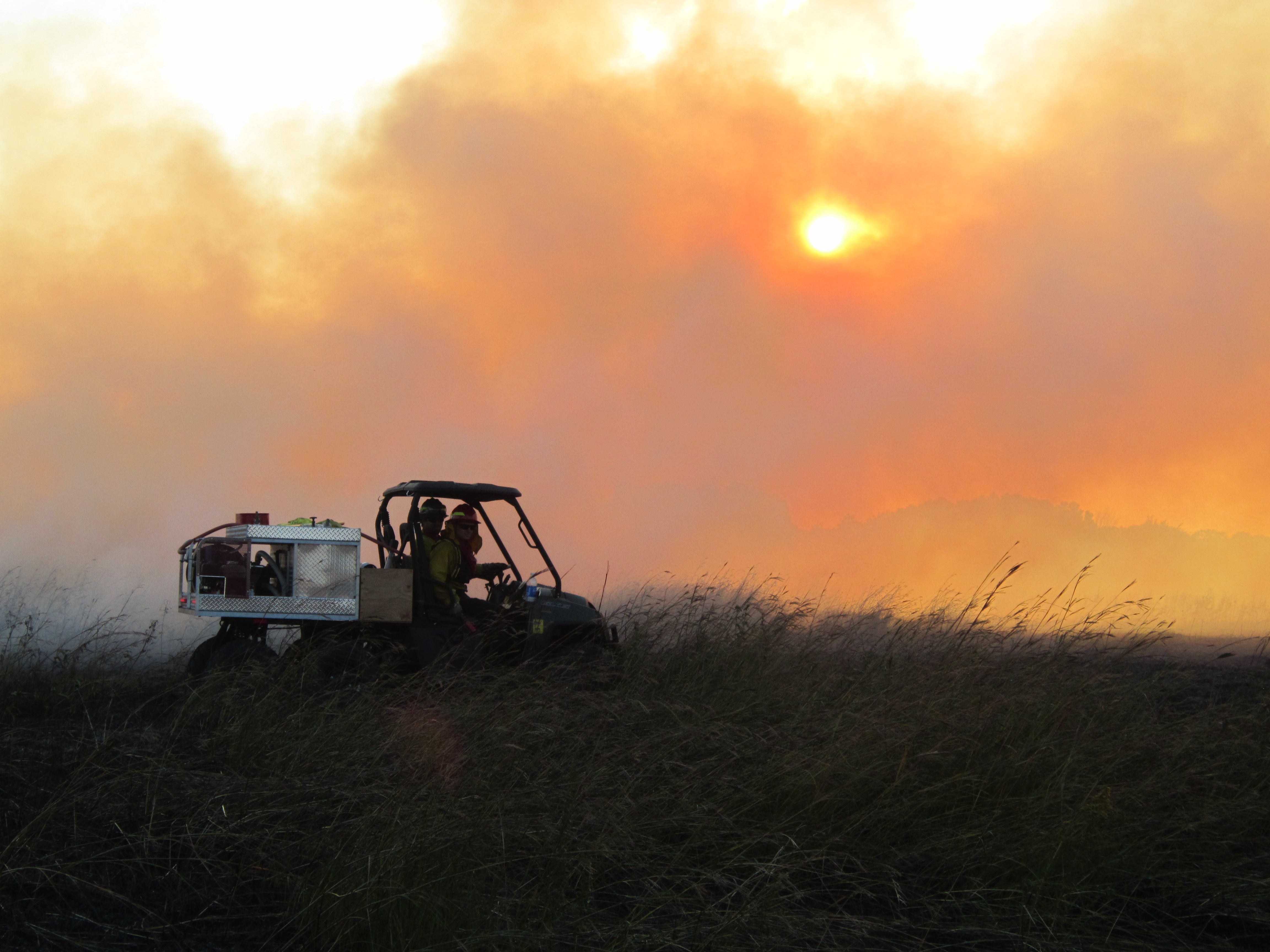 Controlled burning of a prairie.